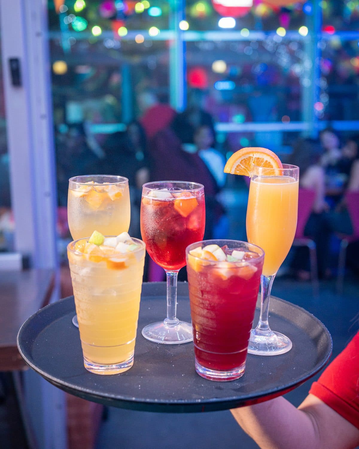 A tray of mimosas and sangrias carried through the dining room